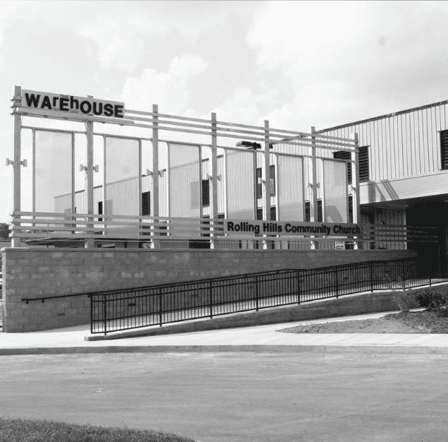 Rolling Hills Community Church building with warehouse signage in the background.